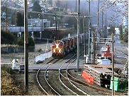 Picture of a train approaching a curve in the tracks.